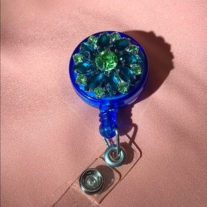Blue and green rhinestone badge reel